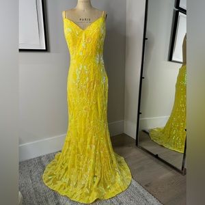 JoVani Yellow Dress
The Jovani 07784A Yellow Pattern Sequin Embellished Gown